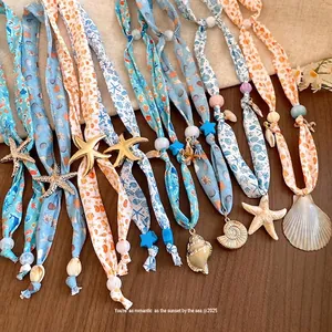 Ocean themed shell and starfish beaded scarf necklace for beach vacation