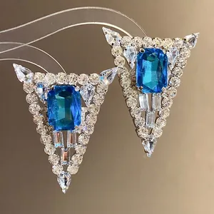 Luxury silver needle triangle stud earrings featuring a square blue gemstone and rhinestones