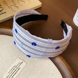 Fascia per capelli larga in tessuto a righe elegante con pois blu, accessorio di tendenza