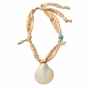 Ocean themed shell and starfish beaded silk scarf necklace for summer beach vacation