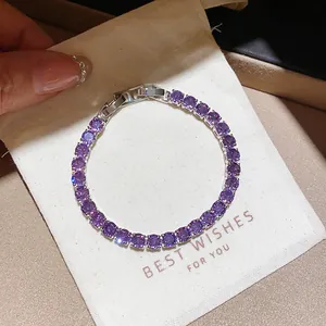 Close-up detail of an exquisite purple zircon tennis bracelet with silver-tone metal setting