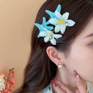 Elegant blue starfish and white flower hair clips set for a charming beach vacation look