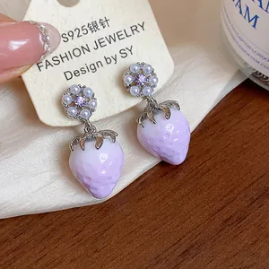 Close-up of purple resin strawberry earrings with pearl flower studs and S925 silver needles.