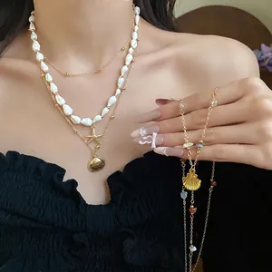 Layered sea shell and starfish pendant necklace set for vacation style