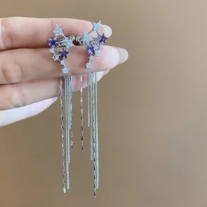 Elegant silver-tone star tassel ear clips featuring purple zircons for non-pierced ears