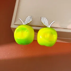 Vibrant green resin apple stud earrings with pavé-set cubic zirconia stems