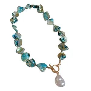 Elegant blue beaded necklace with large baroque pearl pendant and gold OT toggle clasp.