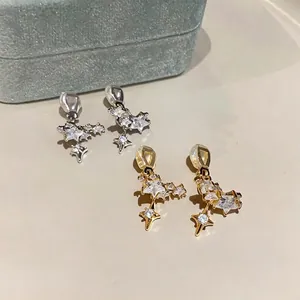 Elegant 14k gold and silver plated starburst ear clips with sparkling cubic zirconia