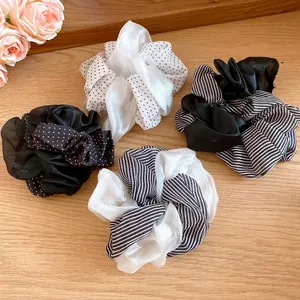 Elegant double-layer fabric scrunchies with classic polka dots and stripes patterns in four styles