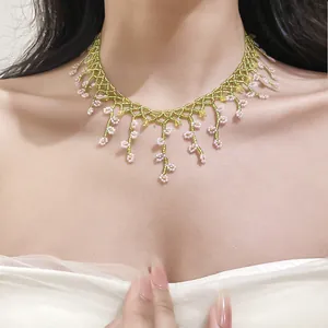 French style beaded fringe necklace with pink floral details on a green choker base