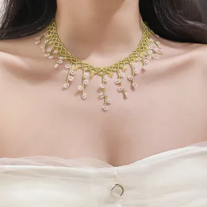 Detailed shot of a French luxury style floral fringe beaded choker necklace on model