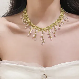 Close-up of a handmade beaded floral fringe choker necklace in French chic style.