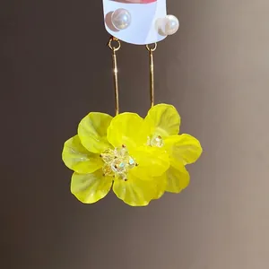 Elegant yellow flower drop earrings with pearl accents and silver needles for vacation style