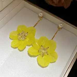 Elegant yellow flower drop earrings with pearl and crystal bead details