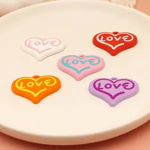 Set of colorful spray-painted alloy heart pendants with LOVE inscription for DIY