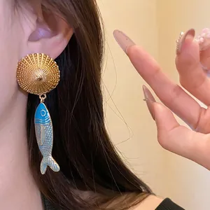 Vintage silver needle fish pendant earrings with gold sunburst stud and blue enamel finish