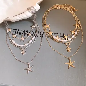 Bohemian layered starfish and pearl pendant necklaces in gold and silver finishes