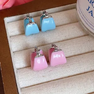 Minimalist enamel U-shaped hoop earrings in pink and light blue colors