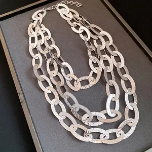 Elegant triple-layered silver oval link necklace with hammered texture for women
