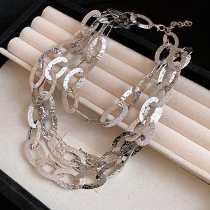 High-end minimalist triple-layer silver necklace featuring unique textured oval links