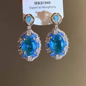 Orecchini a cerchio in zircone blu ovale di lusso con montatura in argento vintage