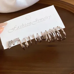 Stylish silver-plated geometric earring set with rhinestones on a display card