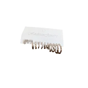 Silver geometric earring set with rhinestones on a white display card for women