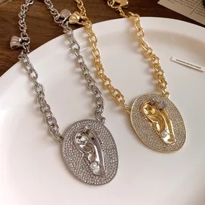 Detailed view of luxury zircon pearl oval ear pendant necklaces in gold and silver
