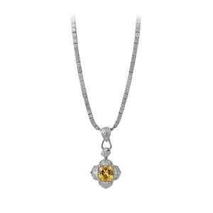 Luxury silver-tone necklace featuring a square yellow zircon pendant and intricate engraving