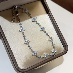 Elegant flower bracelet with sparkling zircons and turquoise beads in a gift box