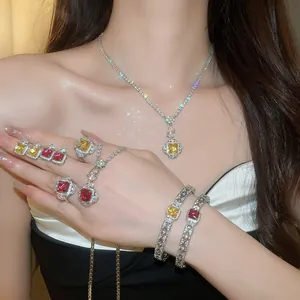 Elegant luxury zircon jewelry set featuring square red and yellow gemstones worn by a model