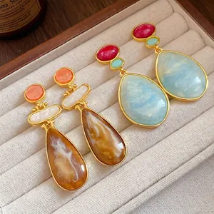 Elegant vintage resin teardrop earrings with amber and sky blue marbled textures