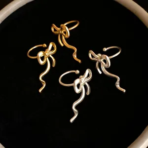 Elegant bow-knot ear cuffs for non-pierced ears in gold and silver matte finishes