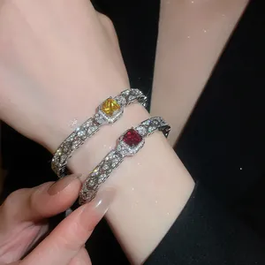 Elegant silver bracelets featuring vibrant yellow and red square zirconia center stones.