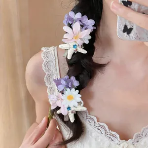 Close-up of French floral starfish hair clips worn on a braided hair detail view