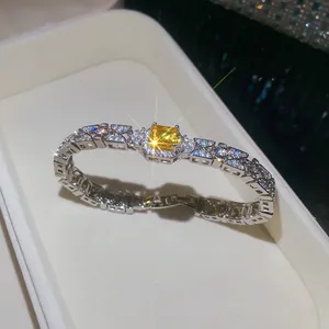 Close-up of a luxury square yellow zircon bracelet with shimmering diamond accents.