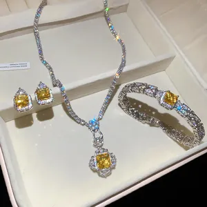 Detail of a luxury jewelry set featuring yellow square-cut zircons in a necklace and bracelet.