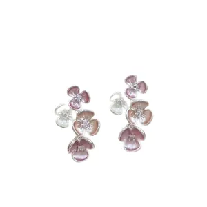 Elegant gradient pink and peach enamel flower stud earrings with sparkling crystal centers