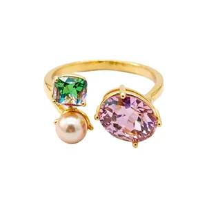 Elegant gold-plated open ring with oval pink stone, square green gem, and pearl