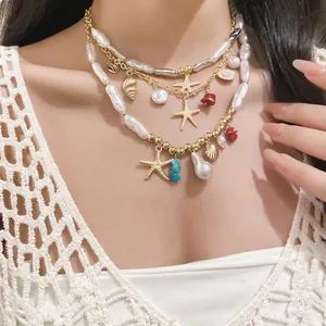 Elegant multi-layered shell and starfish pearl necklace designed for a chic summer resort style