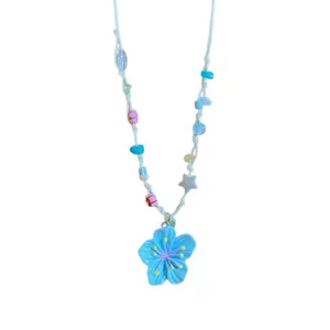 Vibrant dopamine style beaded necklace with blue flower pendant for summer beach wear