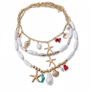 Elegant multilayer gold-toned necklace featuring baroque pearls starfish and sea shell charms