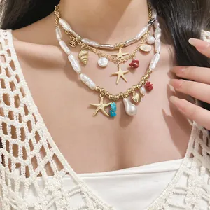 Elegant layered pearl necklace with gold starfish and shell charms for beach vacation look