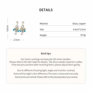 Detailed view of blue beaded flower earrings showing material, size, and weight info
