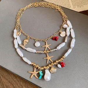 Detailed view of triple-layered vacation necklace with pearls and starfish charms