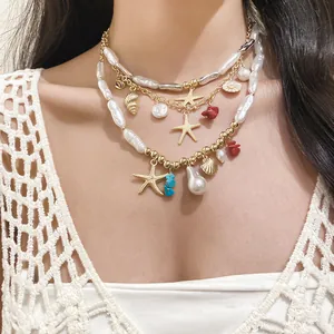 Close-up view of a layered vacation style necklace featuring pearls and starfish charms