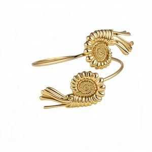 Elegant gold metal nautilus shell arm cuff bracelet with a minimalist chic design for women