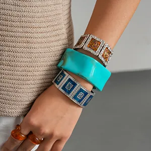Detailed view of retro enamel square elastic bracelets and turquoise resin bangle