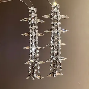 Silver needle earrings with sparkling tassel diamonds in a high-end elegant design