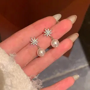 Elegant eight-pointed star snowflake pearl drop earrings with sparkling zircon details